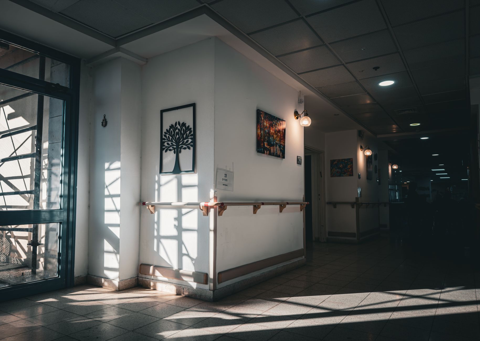 A quiet hospital corridor with afternoon light